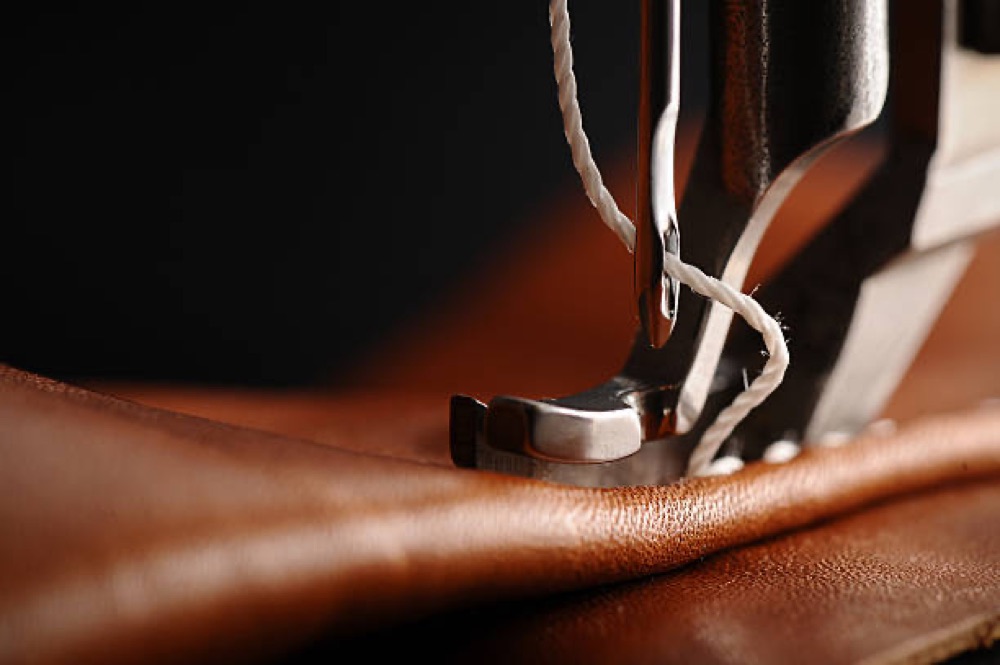 Leather being stitched for a lift interior
